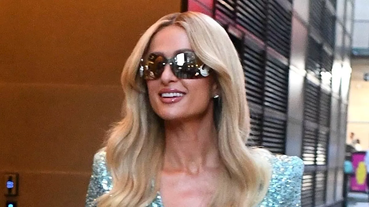 Paris Hilton stuns as she flashes her legs in glittering dress - after releasing second album...