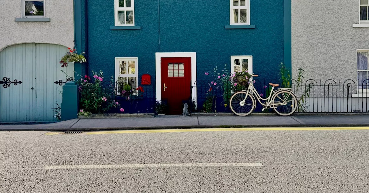 Pretty blue home with big back garden in quaint country village for €295,000