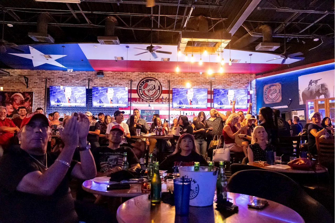 On opposite sides of town, Republicans and Democrats huddled to watch presidential debate