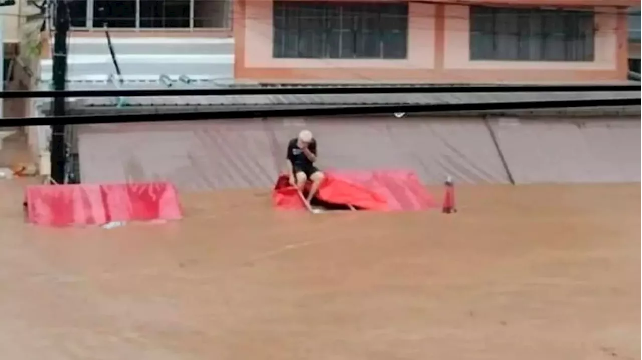 Man, 85, stranded atop tent in flooded district in Chiang Rai rescued