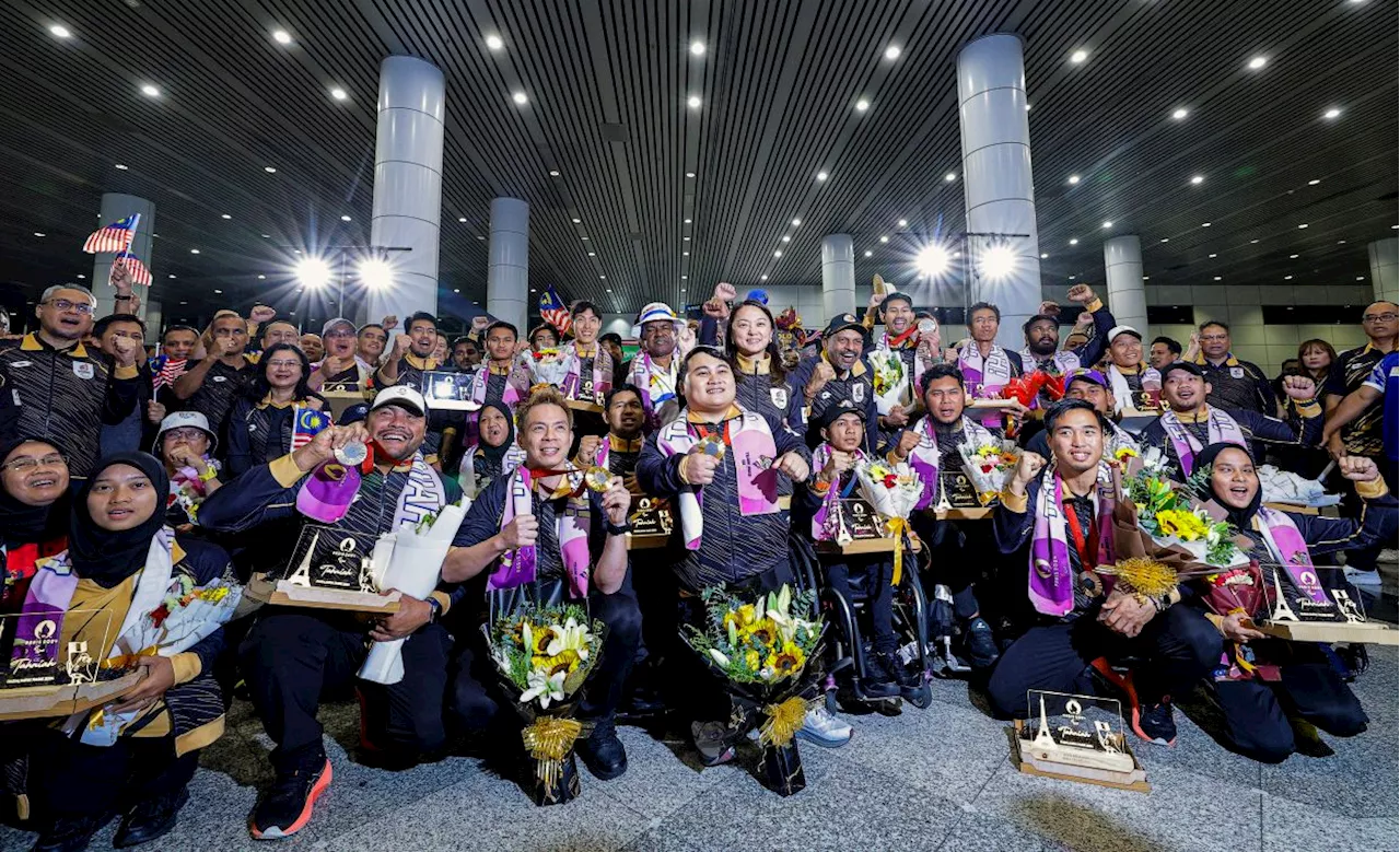 Paris Paralympics athletes return to thunderous applause at KLIA