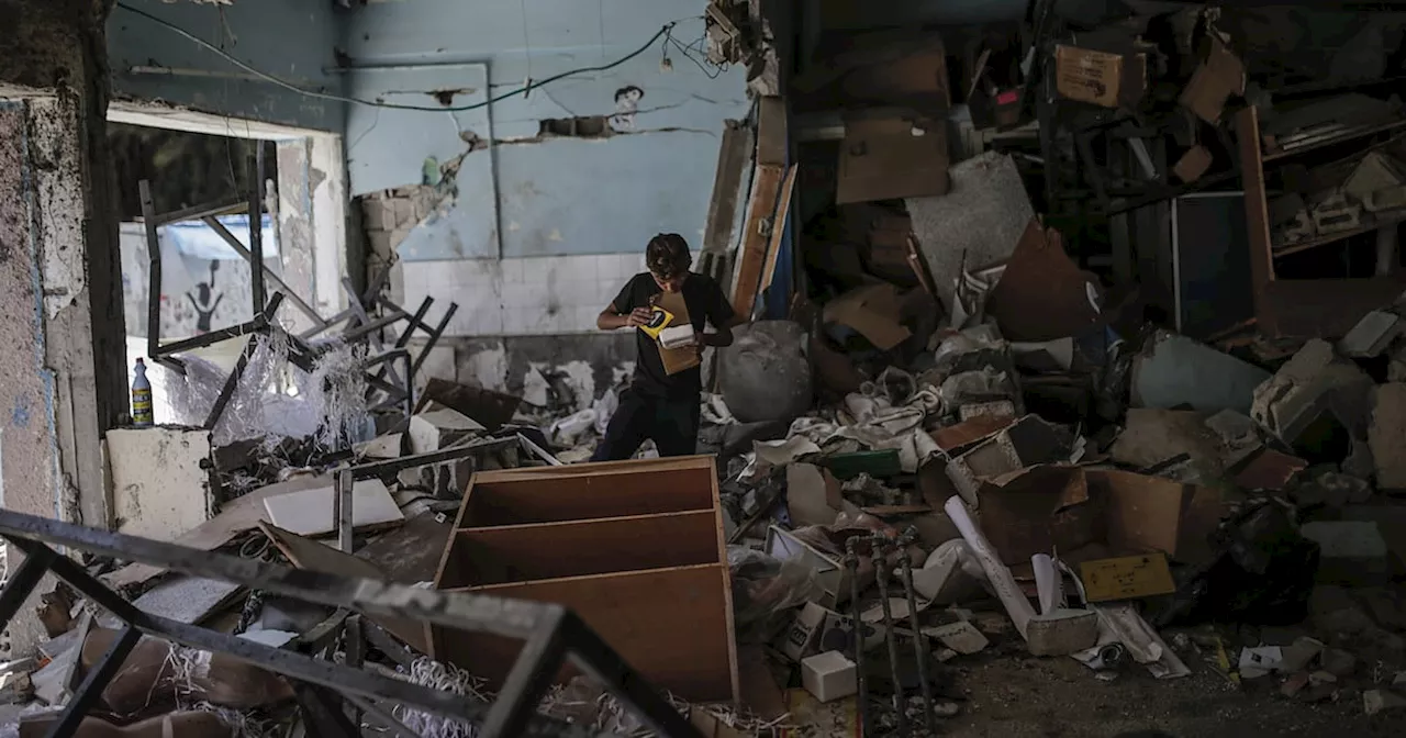 Israeli air strikes kill six UN staff at Gaza school sheltering homeless