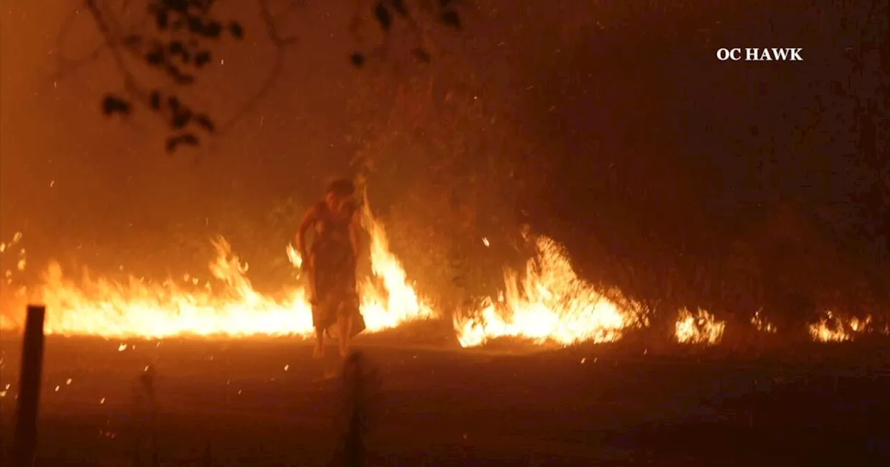 Video shows firefighters rescue woman from blazing Airport fire