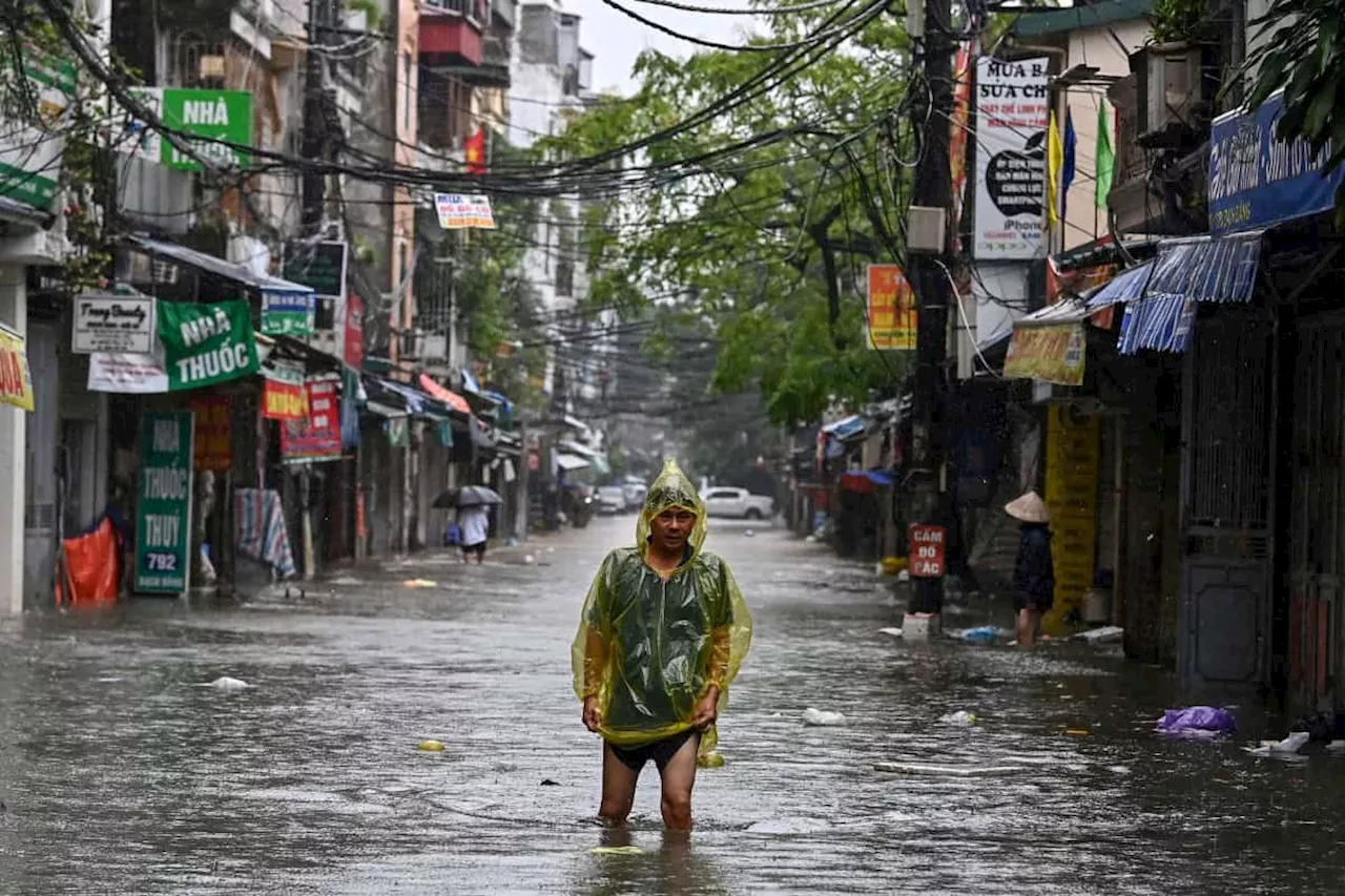 Hanoi residents battle waist-deep floods as Typhoon Yagi toll exceeds 150