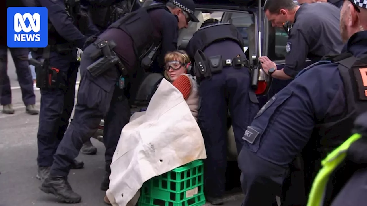 Victorian premier defends Land Forces expo as police arrest woman on third day of Melbourne protest