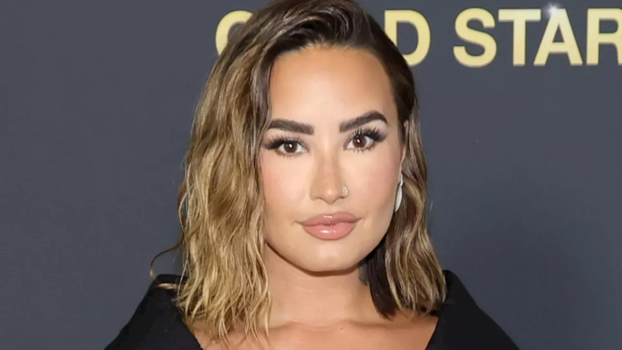 Demi Lovato is jaw-dropping in low-cut dress as she shares a kiss with fiance Jordan Lutes at...