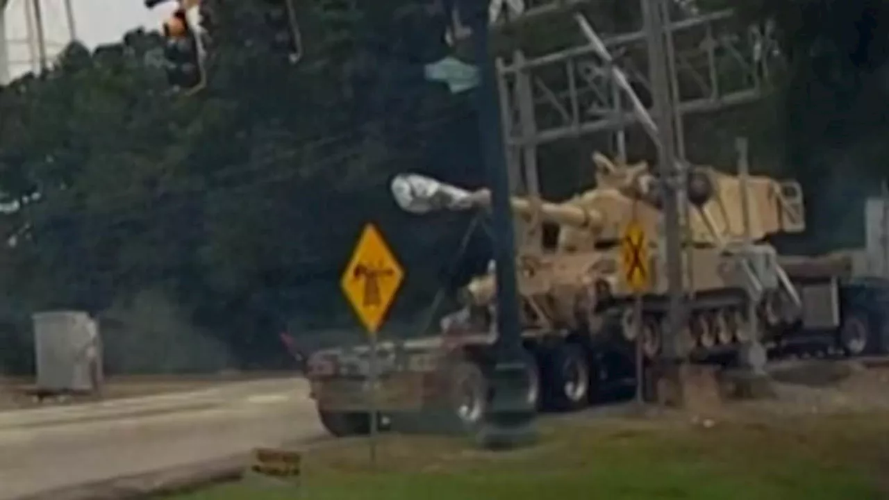 Moment freight train smashes into stranded 18-wheeler