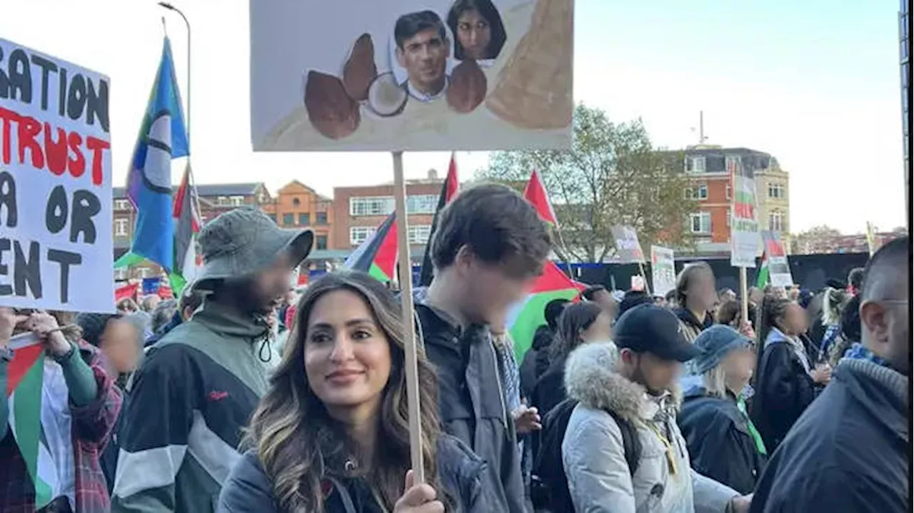 Teacher with placard depicting Rishi Sunak and Suella Braverman as coconuts not guilty of racially...