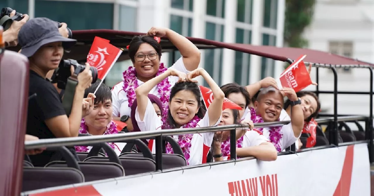 Singapore cheers for Paralympians on celebratory bus parade through town