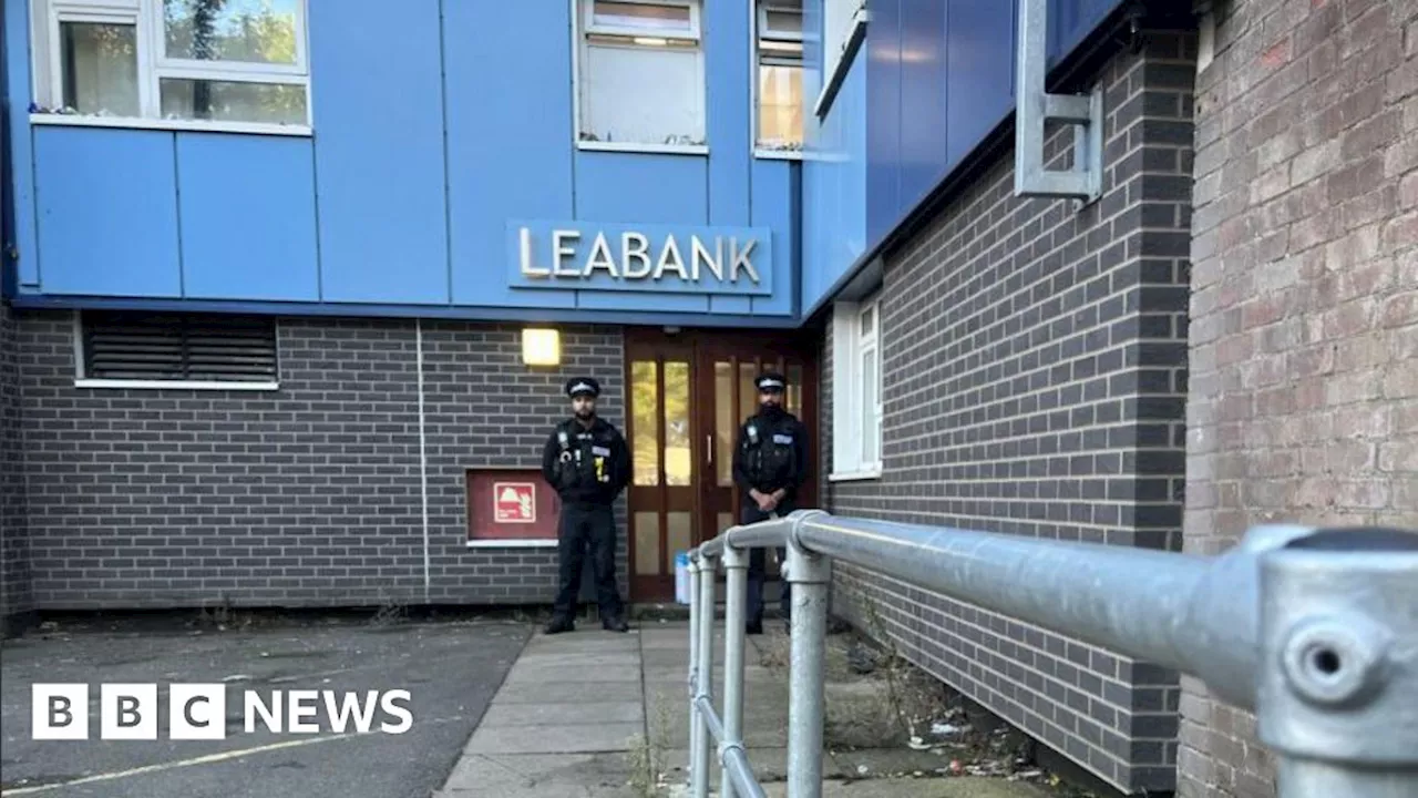 Tributes left as teen held over Luton tower block deaths