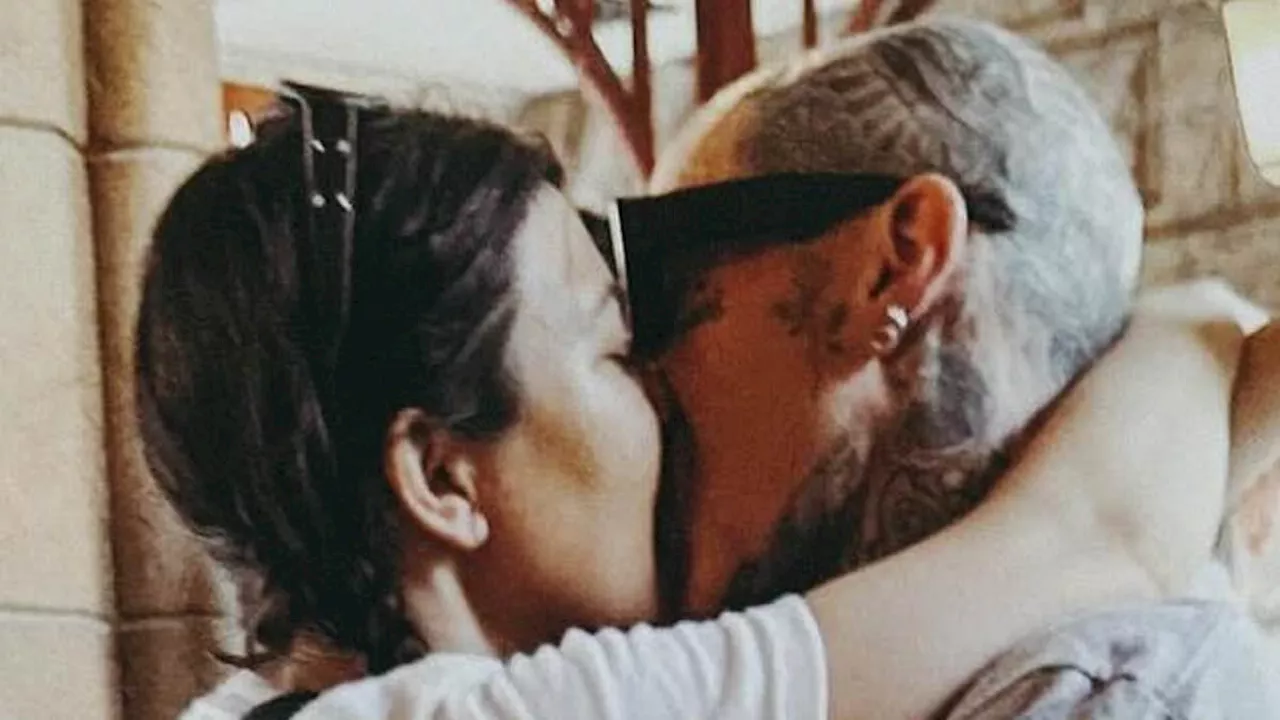 Kourtney Kardashian lovingly kisses husband Travis Barker in throwback photos from summer...