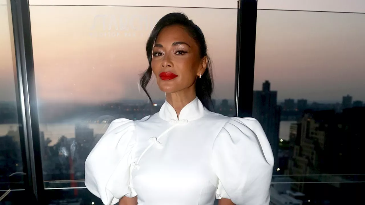 Nicole Scherzinger puts on a leggy display in a chic white mini dress as she hosts a cocktail...