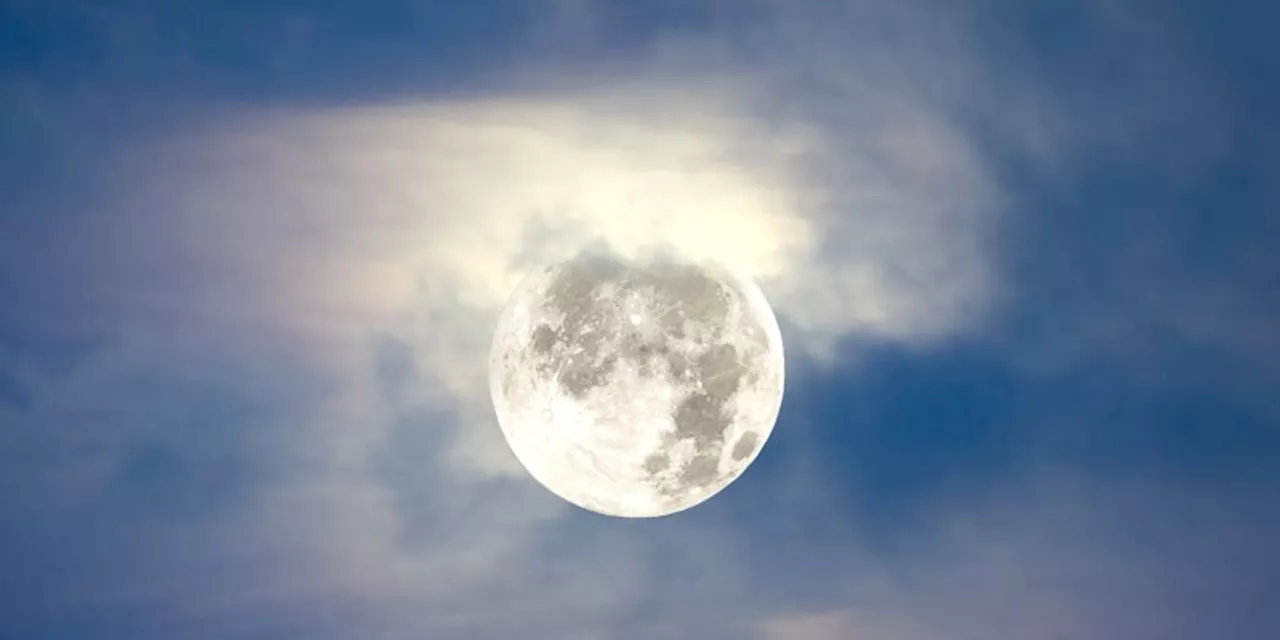 This Month's Full Moon Is A Rare Supermoon & Partial Lunar Eclipse