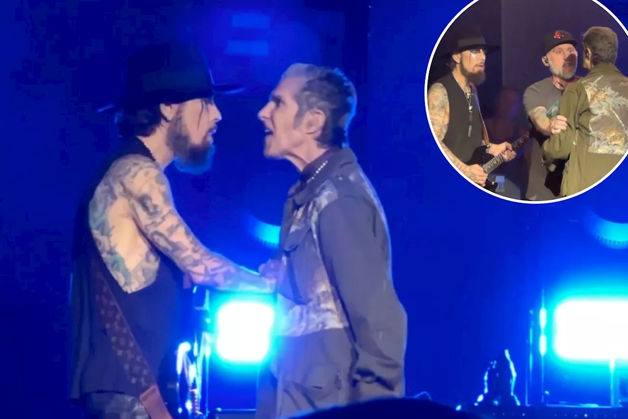 Jane's Addiction frontman Perry Farrell punches guitarist Dave Navarro onstage, abruptly ending Boston concert