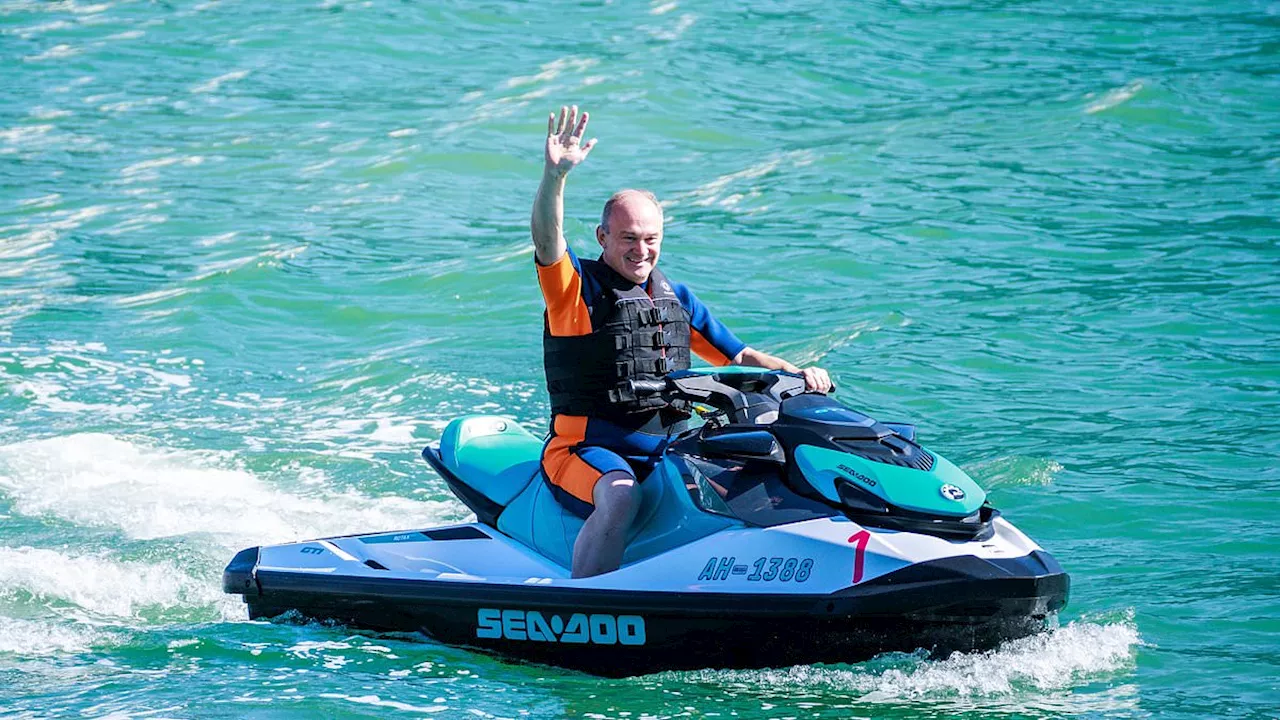 Ed Davey arrives at the Lib Dem conference on a jetski