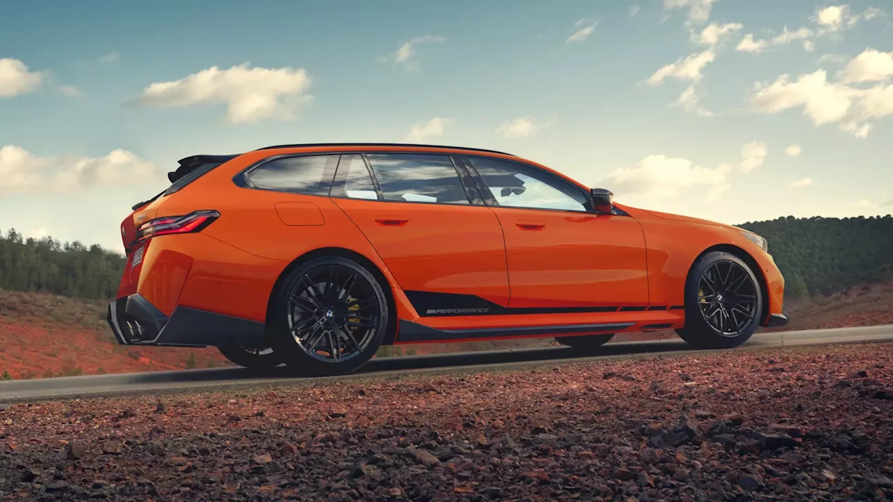 Check out the M Performance parts on this very orange BMW M5 Touring