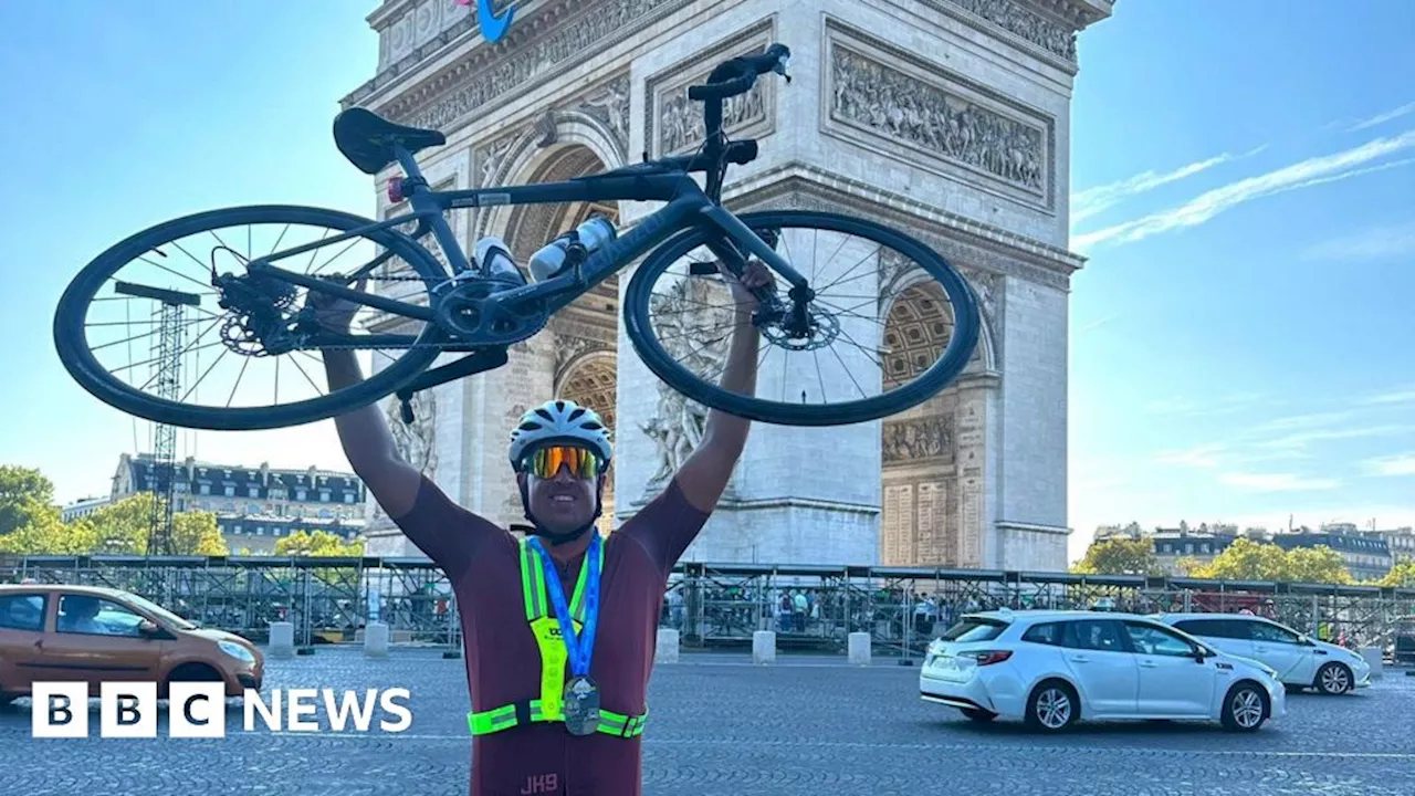 Dad completes 'world's hardest triathlon' in new record time