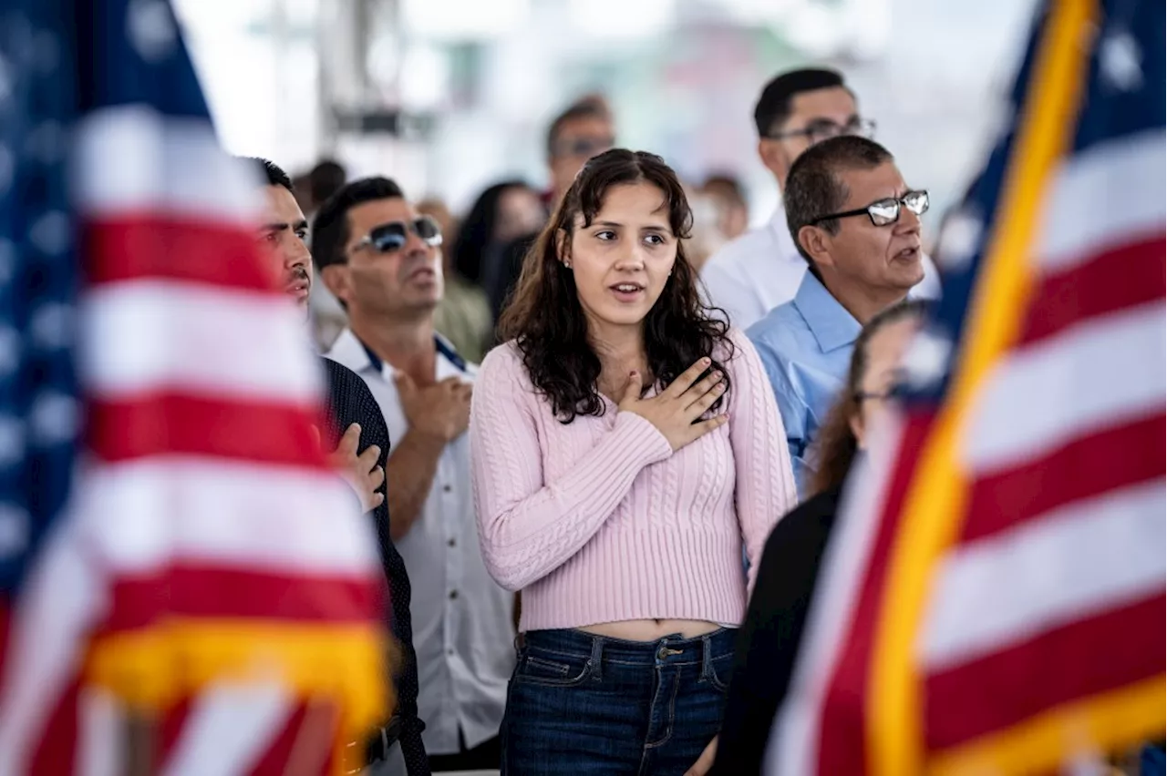 Immigrants from some 20 countries become America’s newest citizens aboard USS Iowa in San Pedro