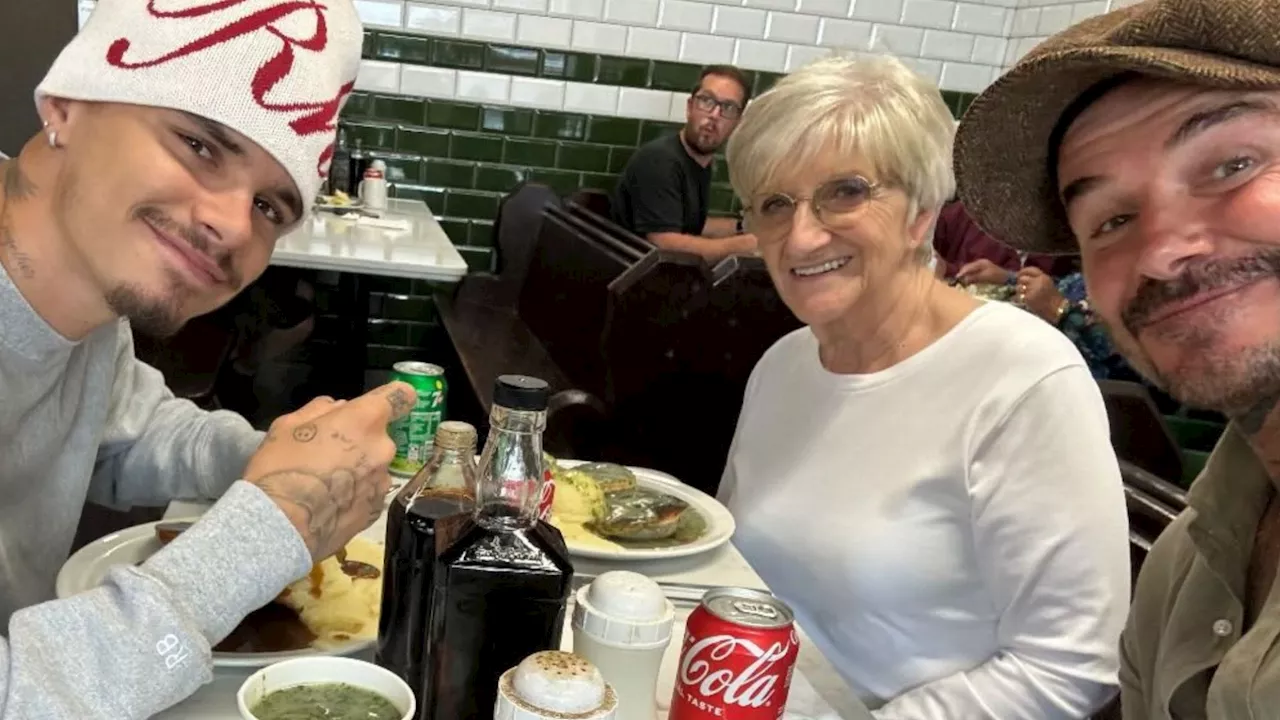 David Beckham makes surprise visit to pie and mash shop with his mum & Romeo...