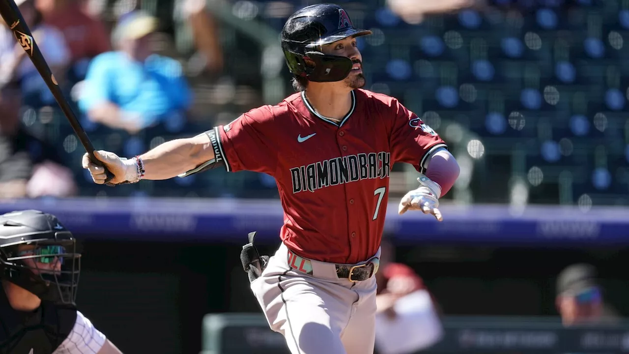 Carroll homers twice and Rodriguez strikes out 11 in Diamondbacks' 9-4 victory over the Rockies