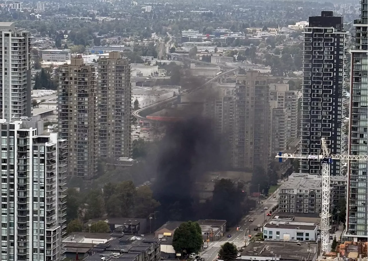 Train exiting hidden tunnel belches black smoke in North Burnaby