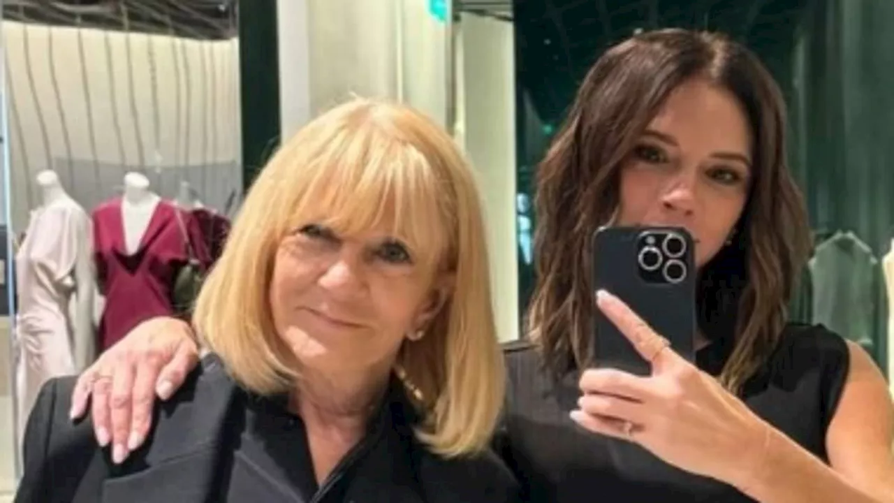 Victoria Beckham looks chic as she visits her London boutique with mum Jackie Adams while David...