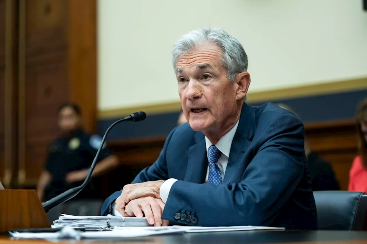 Federal Reserve cuts key interest rate by a half-point