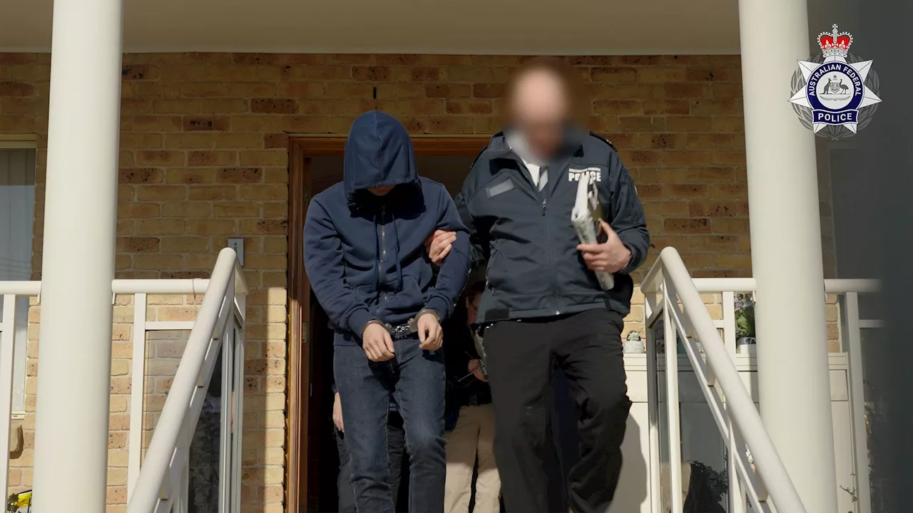 Australia police charge man with being alleged mastermind of global crime app