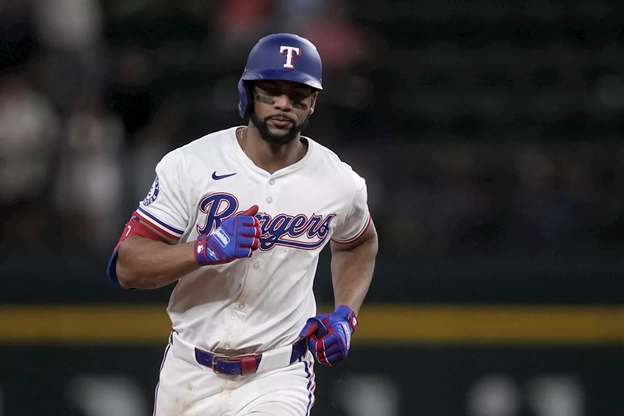 Langford, Heim lead Rangers to wild 13-8 win over Blue Jays