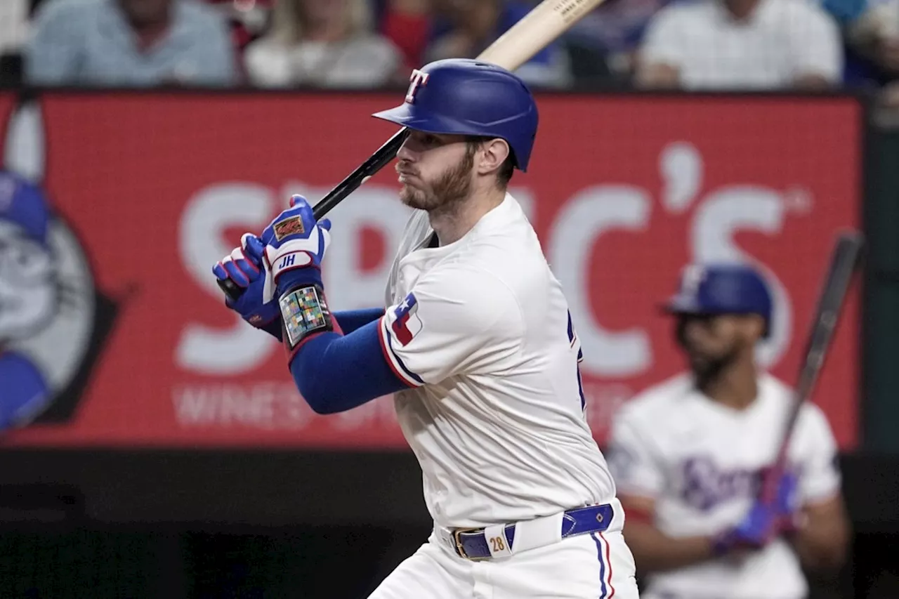 Struggling Heim has key hit as Rangers rout Blue Jays 13-8