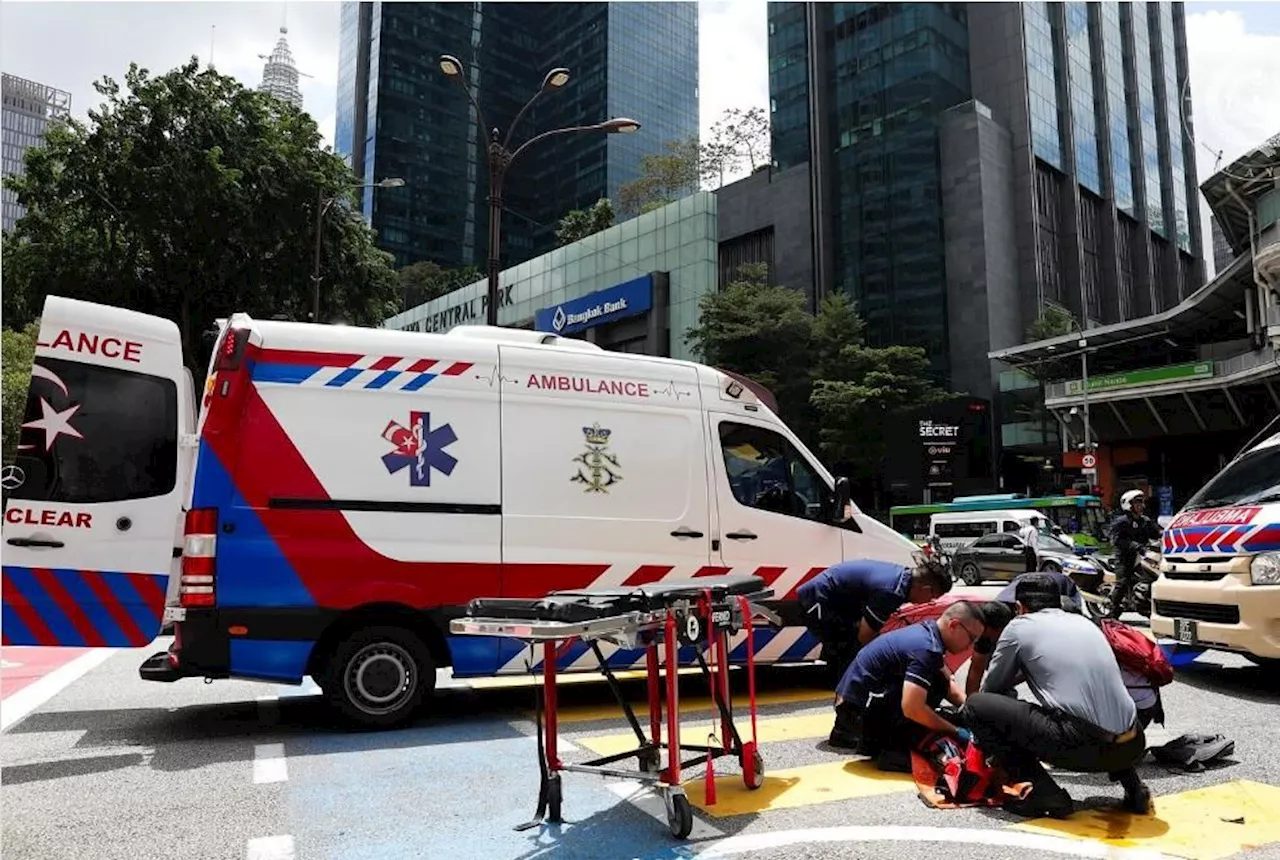 King's private medical team gives emergency treatment to bikers involved in accident in KL