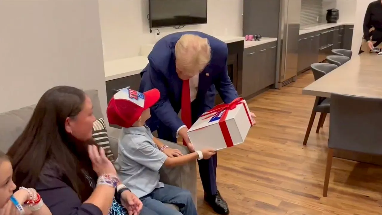 Trump Greets 8-Year-Old With Rare Brain Disorder At Rally, Gifts Him 'Real Good Stuff'