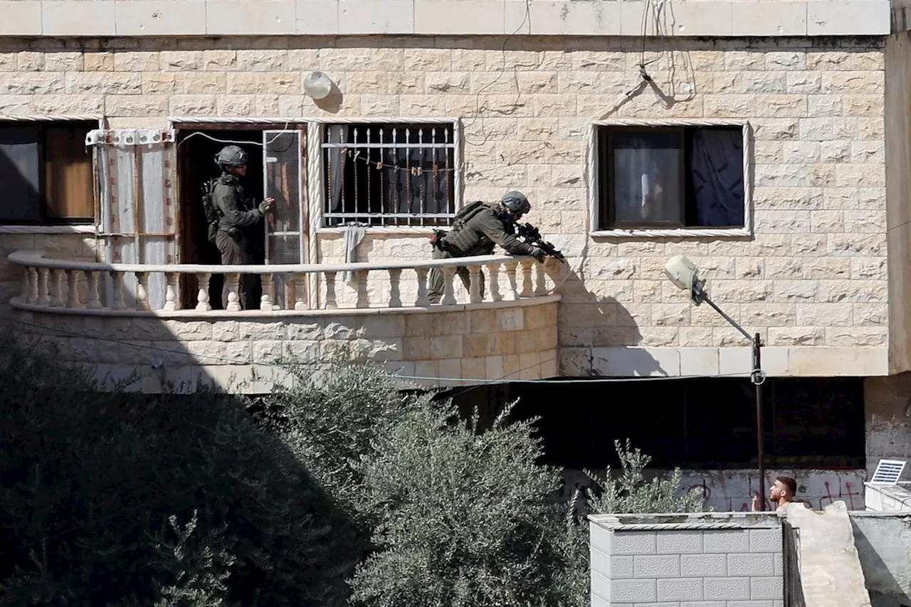 Israeli soldiers pushed three apparently lifeless bodies from roofs during a West Bank raid