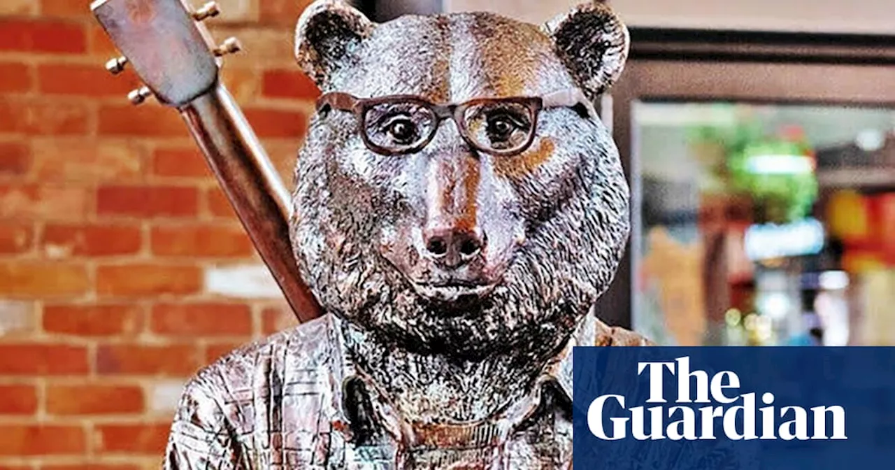 Artists ‘absolutely heartbroken’ after $60,000 bike-riding bear statue stolen from Melbourne laneway