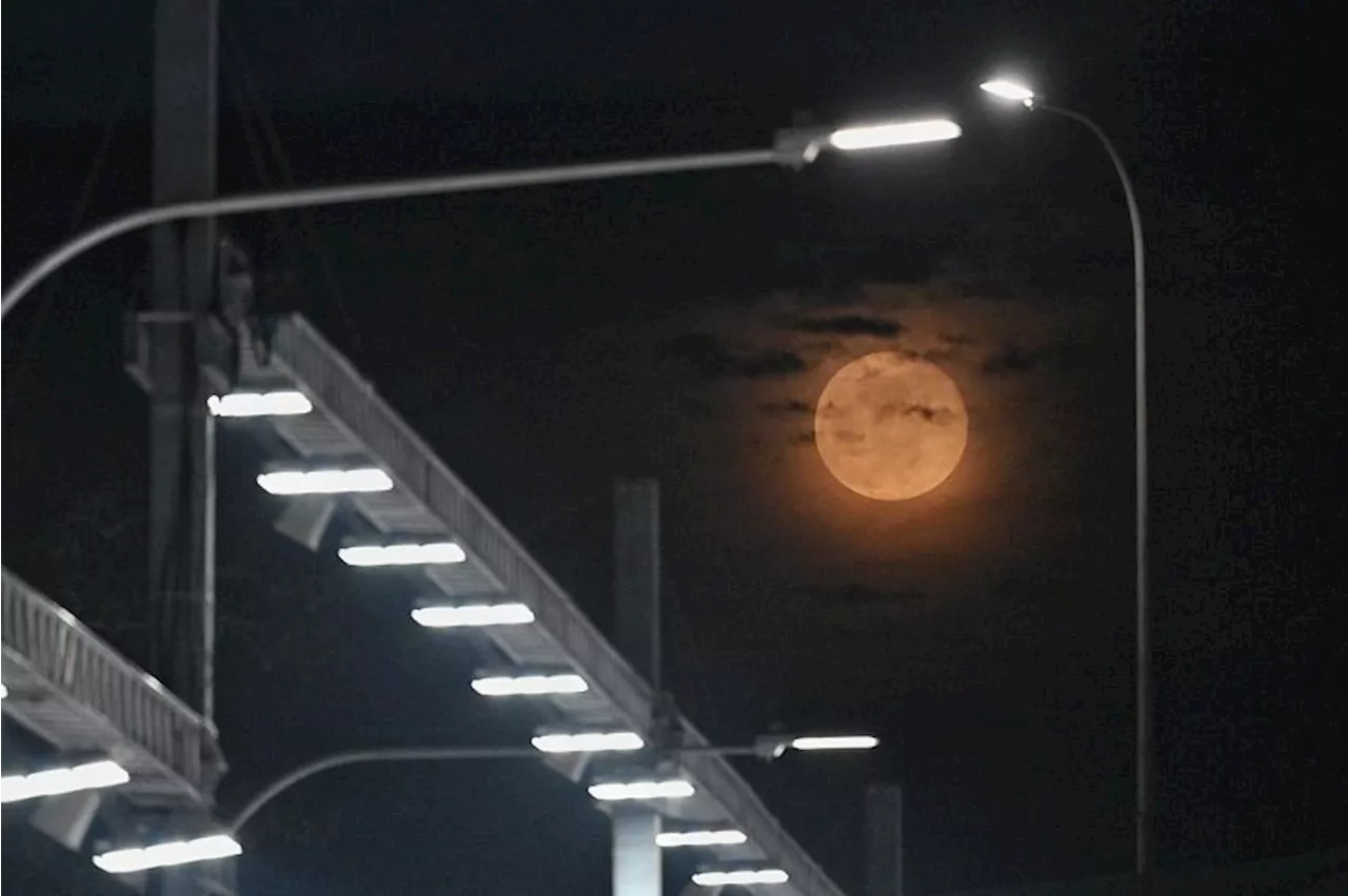 ‘Clouds on fire’: Harvest Moon bewitches skygazers in Singapore despite thick clouds