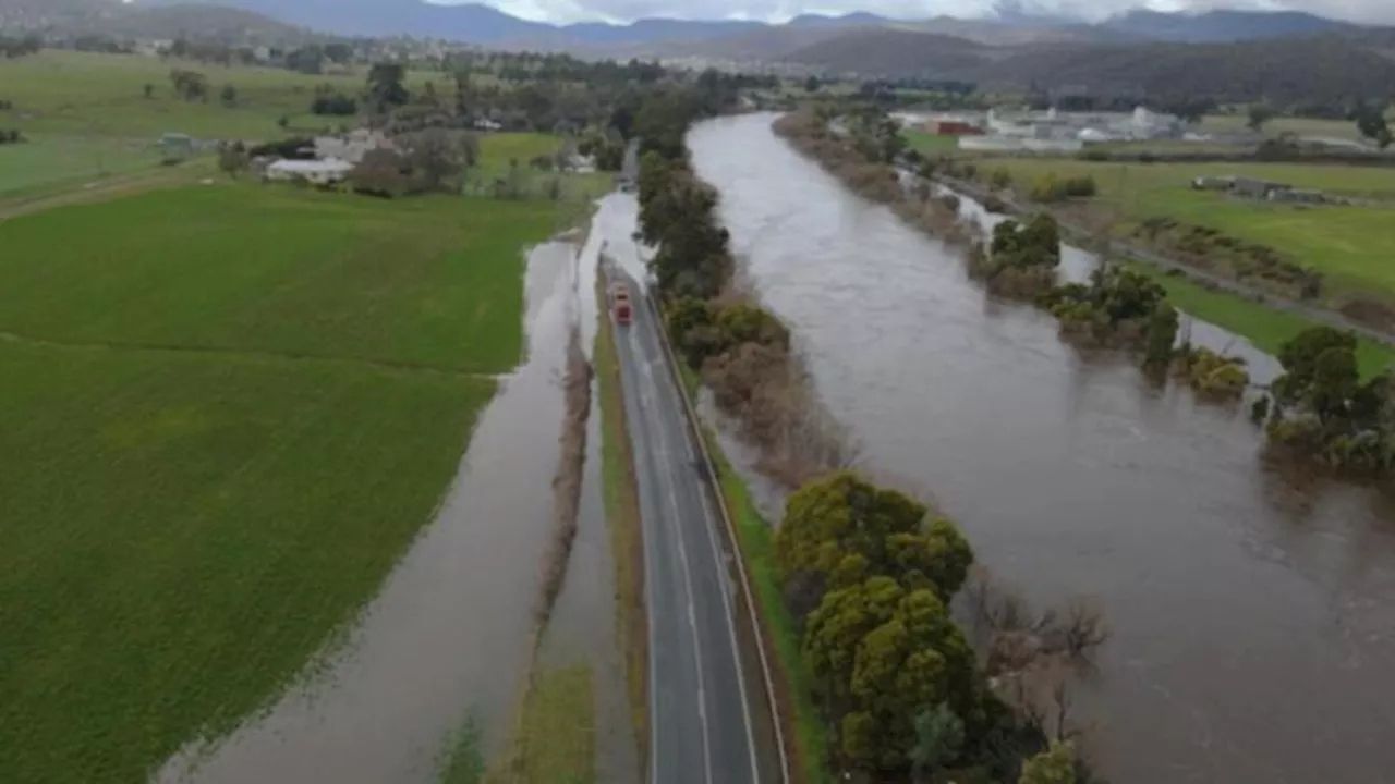 Warnings continue after wild weather leaves one dead in NSW