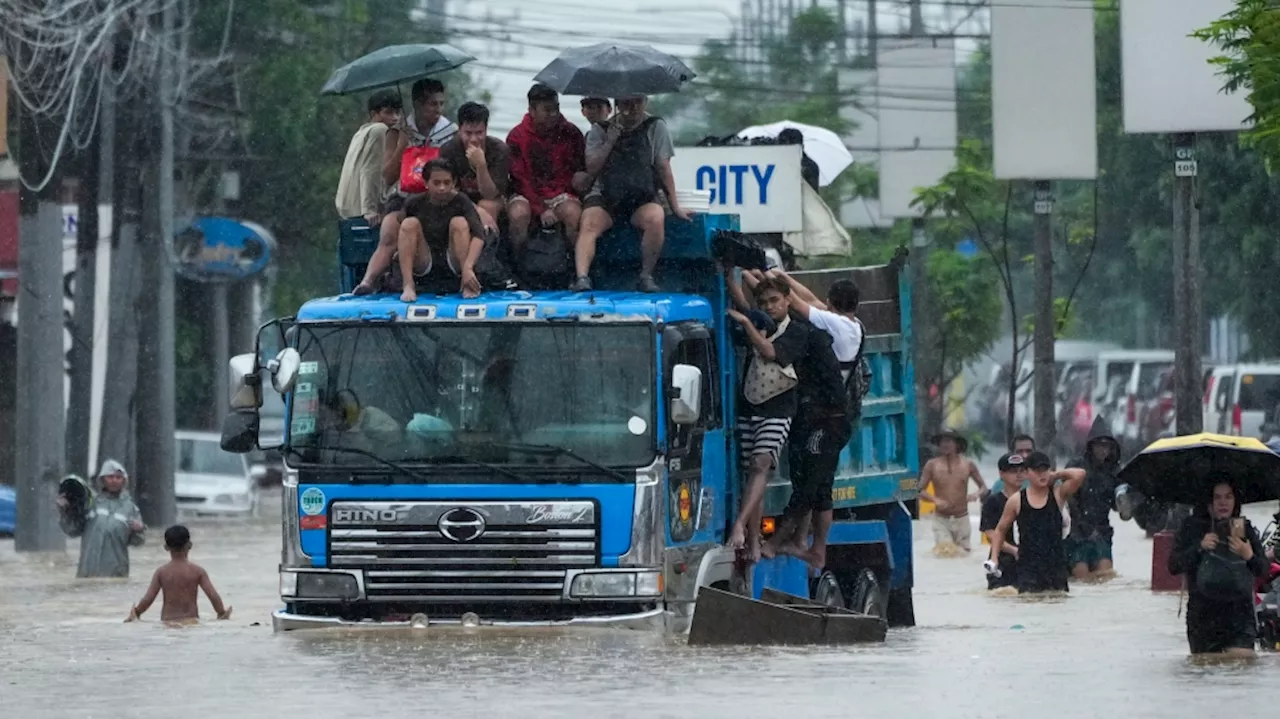 Storm sets off floods and landslides in Philippines, leaving at least 14 dead