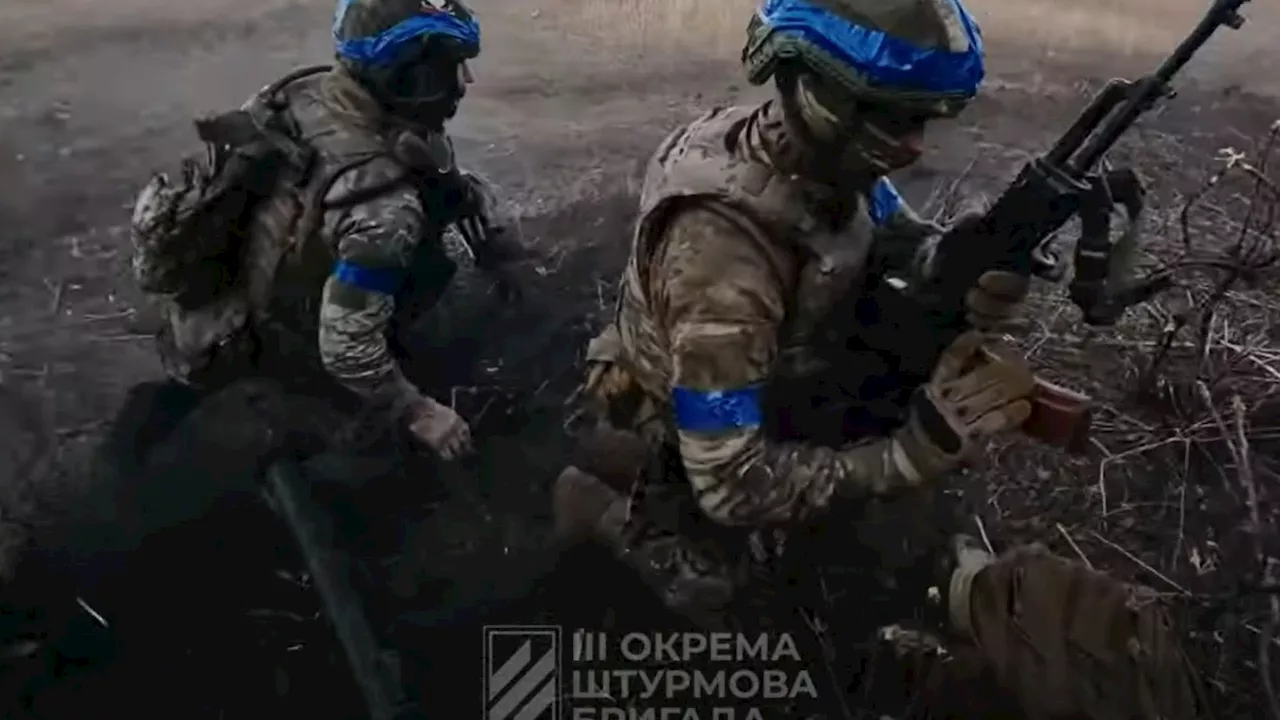 Heart-stopping first-person video shows Ukrainian troops storming Russian trenches as they dodge machine...