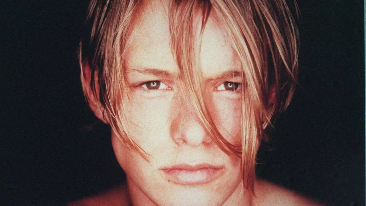 Nineties heartthrob Adam Rickitt looks almost unrecognisable as he shows off shock new look...