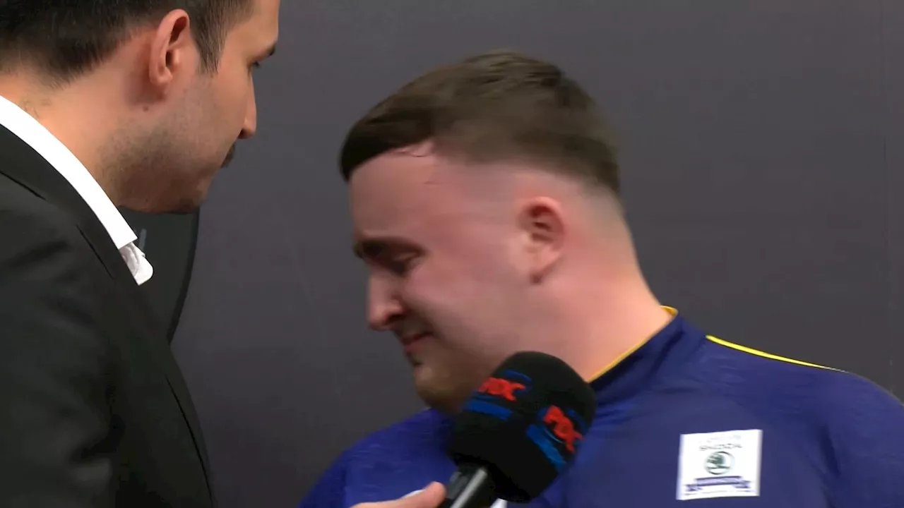 Tearful Luke Littler consoled by announcer and Peter Wright after German Darts final loss as fans take aim...