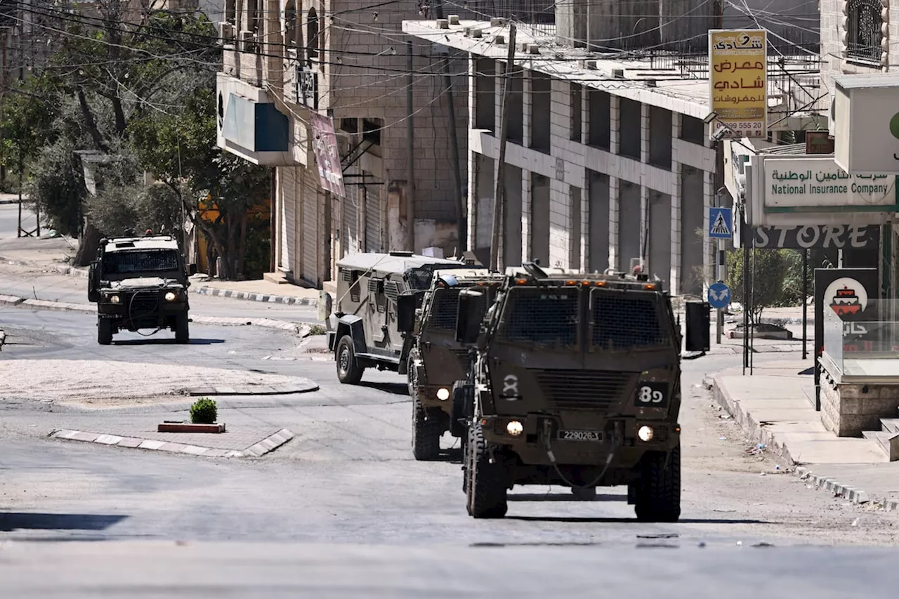 Israeli military investigating after videos show soldiers pushing bodies off West Bank roof