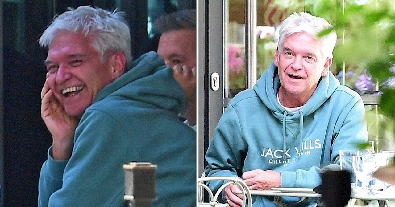 Phillip Schofield pictured looking jubilant while still wearing wedding ring