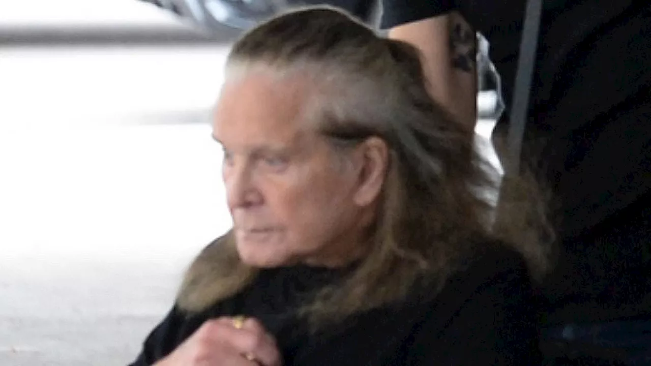 Ozzy Osbourne looks frail in LA with wife Sharon - after she said his health has delayed their move...