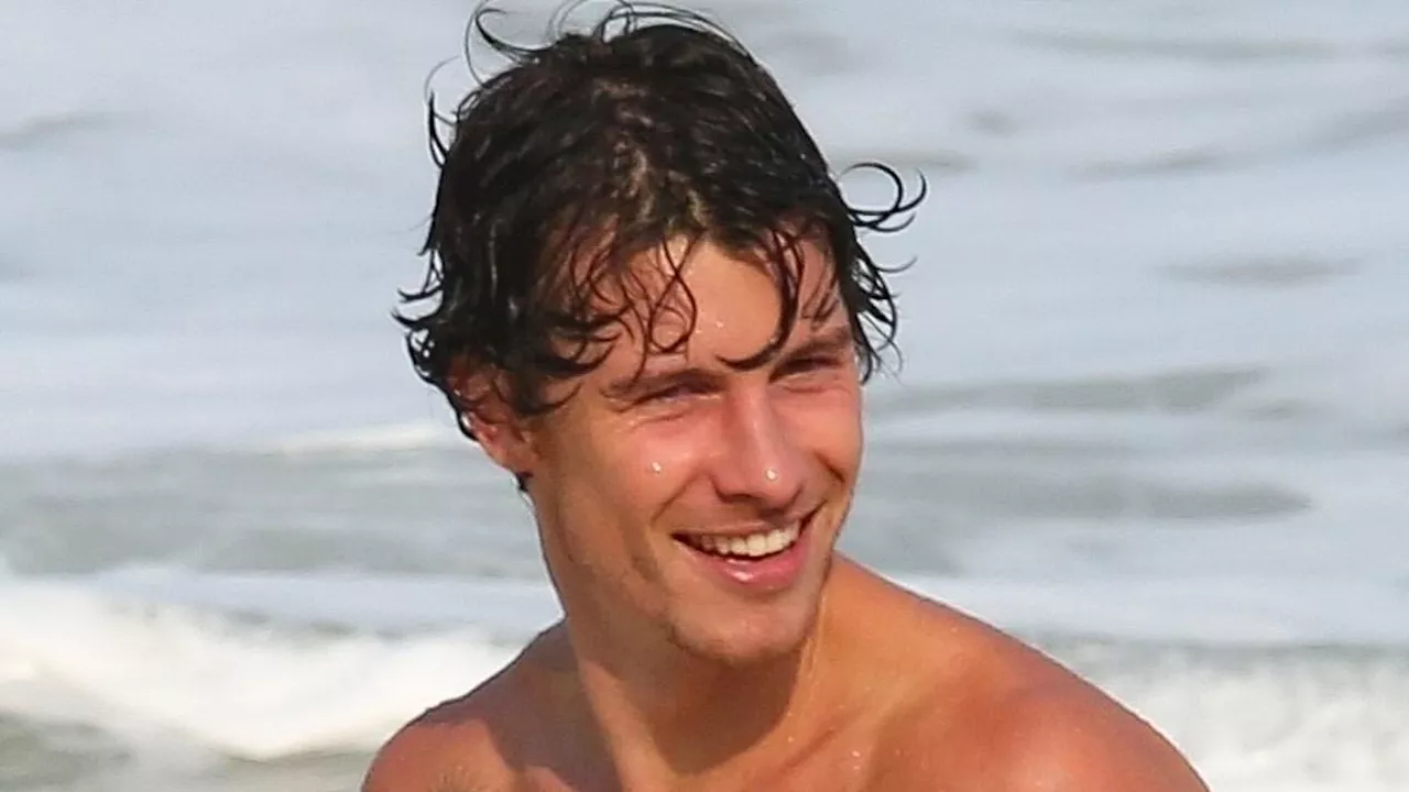 Shawn Mendes shows off fit physique as he goes shirtless for beach day in Brazil ahead of Rock In...