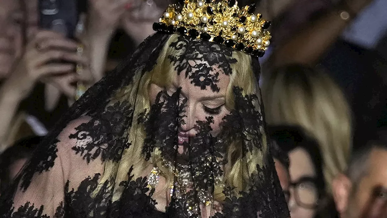 Madonna makes veiled entrance to Dolce & Gabbana for show marking 1990s heyday