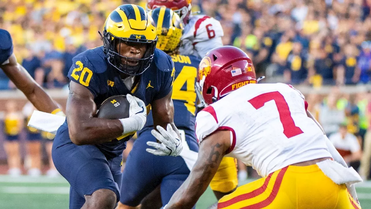 Michigan, held to 32 yards passing, goes run-heavy to top USC