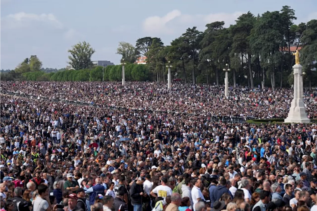 An estimated 180,000 motorcyclists converge at Portuguese shrine to have their helmets blessed.