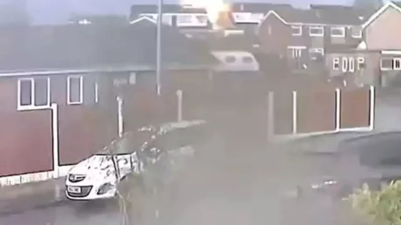 Watch moment lightning strikes home triggering ‘huge explosion’ with neighbours forced to evacuate as sto...