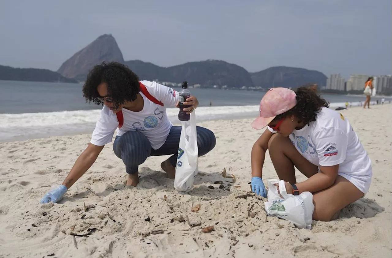 Volunteers clean Flamengo Beach marking World Cleanup Day in Rio de Janeiro