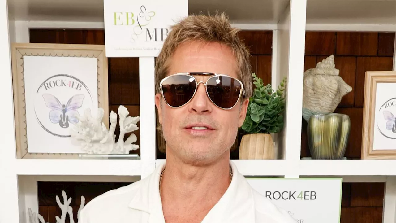 Brad Pitt and girlfriend Ines de Ramon cozy up to each other at star-studded Rock4EB benefit in...